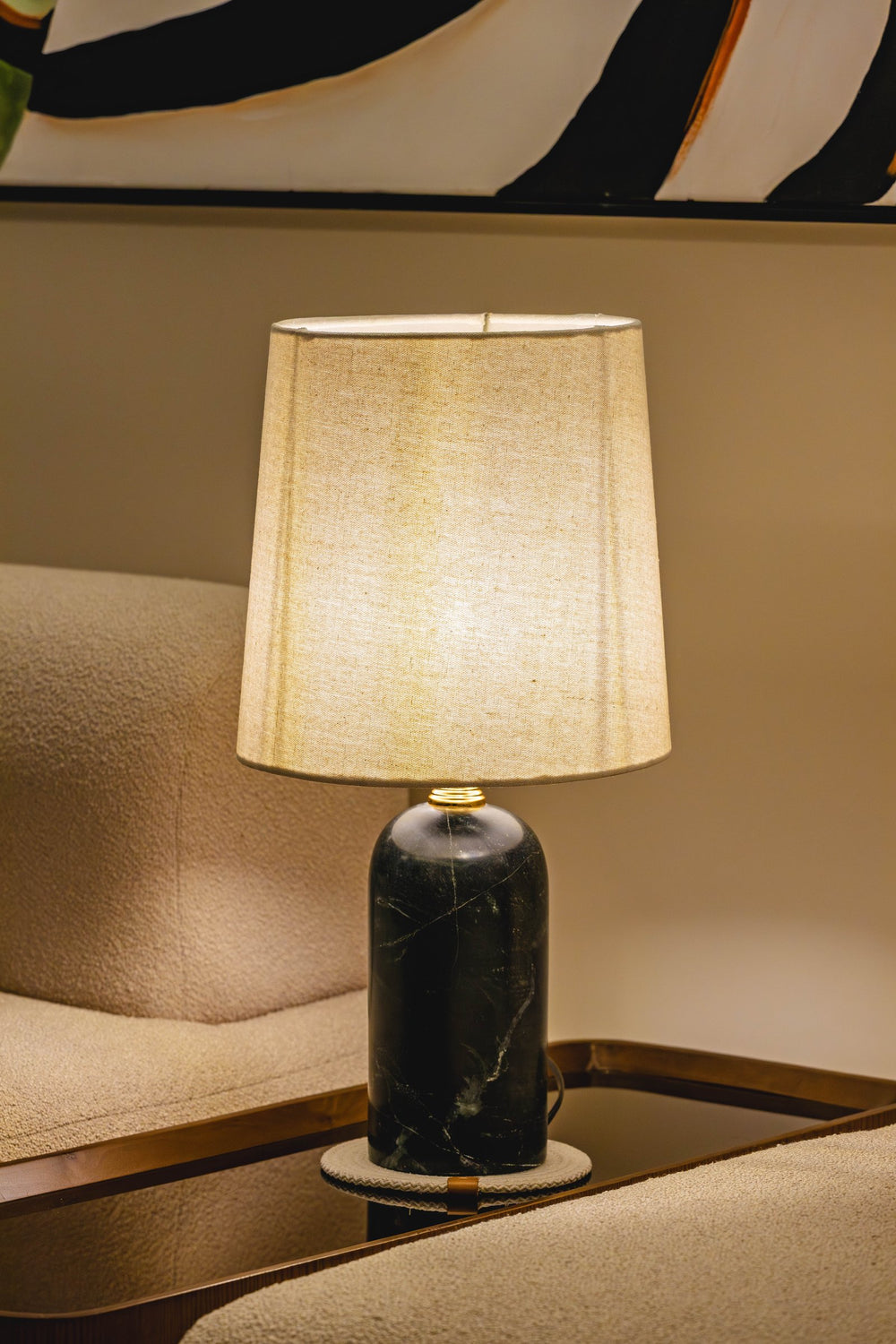 03-real | OBSEDIAN Table Lamp — lit beside a sofa