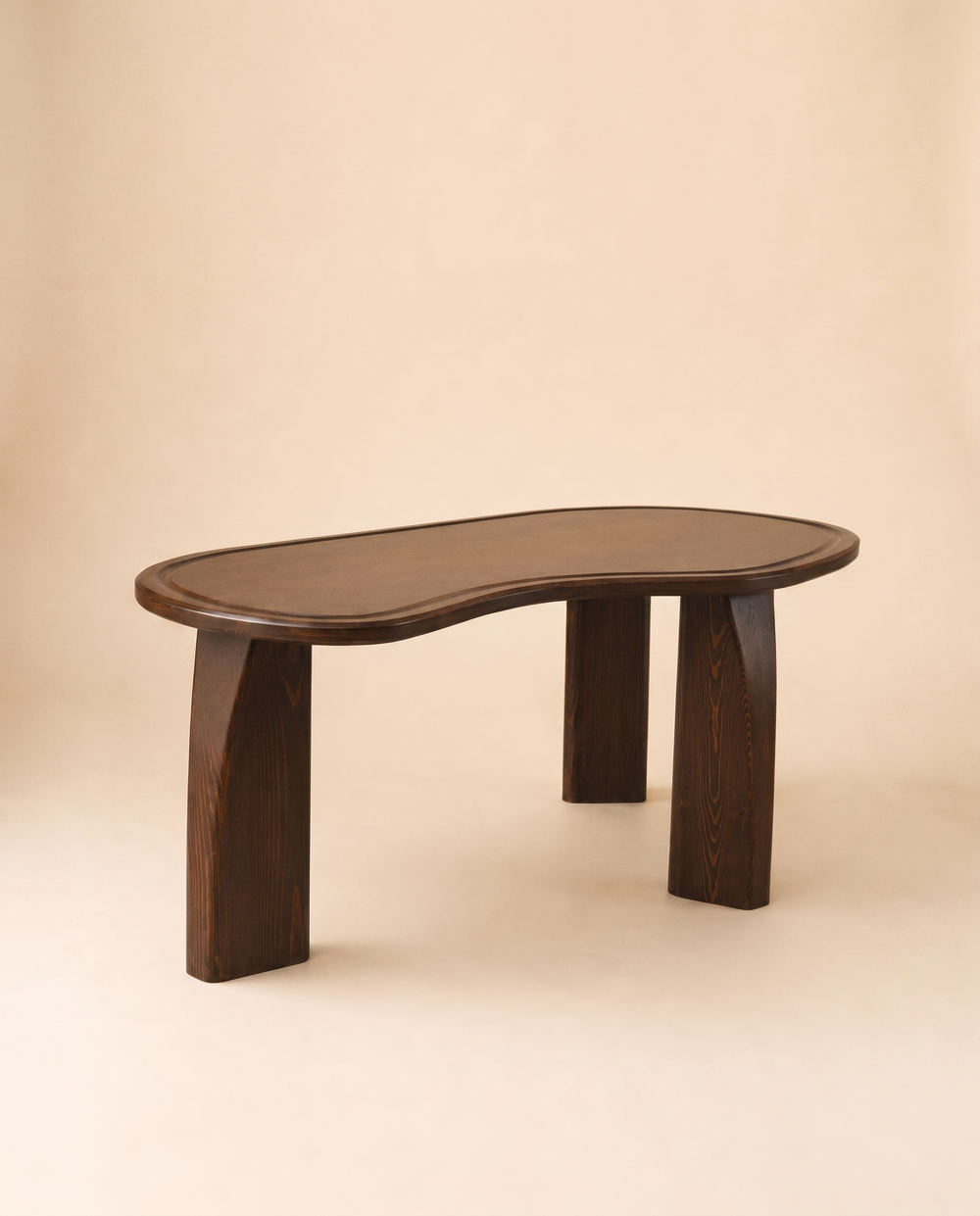 KEMET Coffee Table in solid beech with pine legs, on a warm seamless backdrop