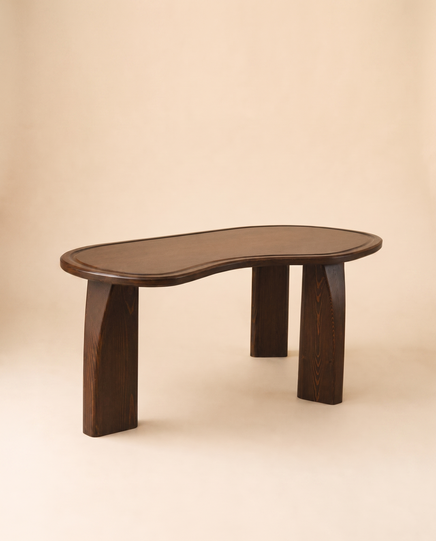 KEMET Coffee Table in solid beech with pine legs, on a warm seamless backdrop
